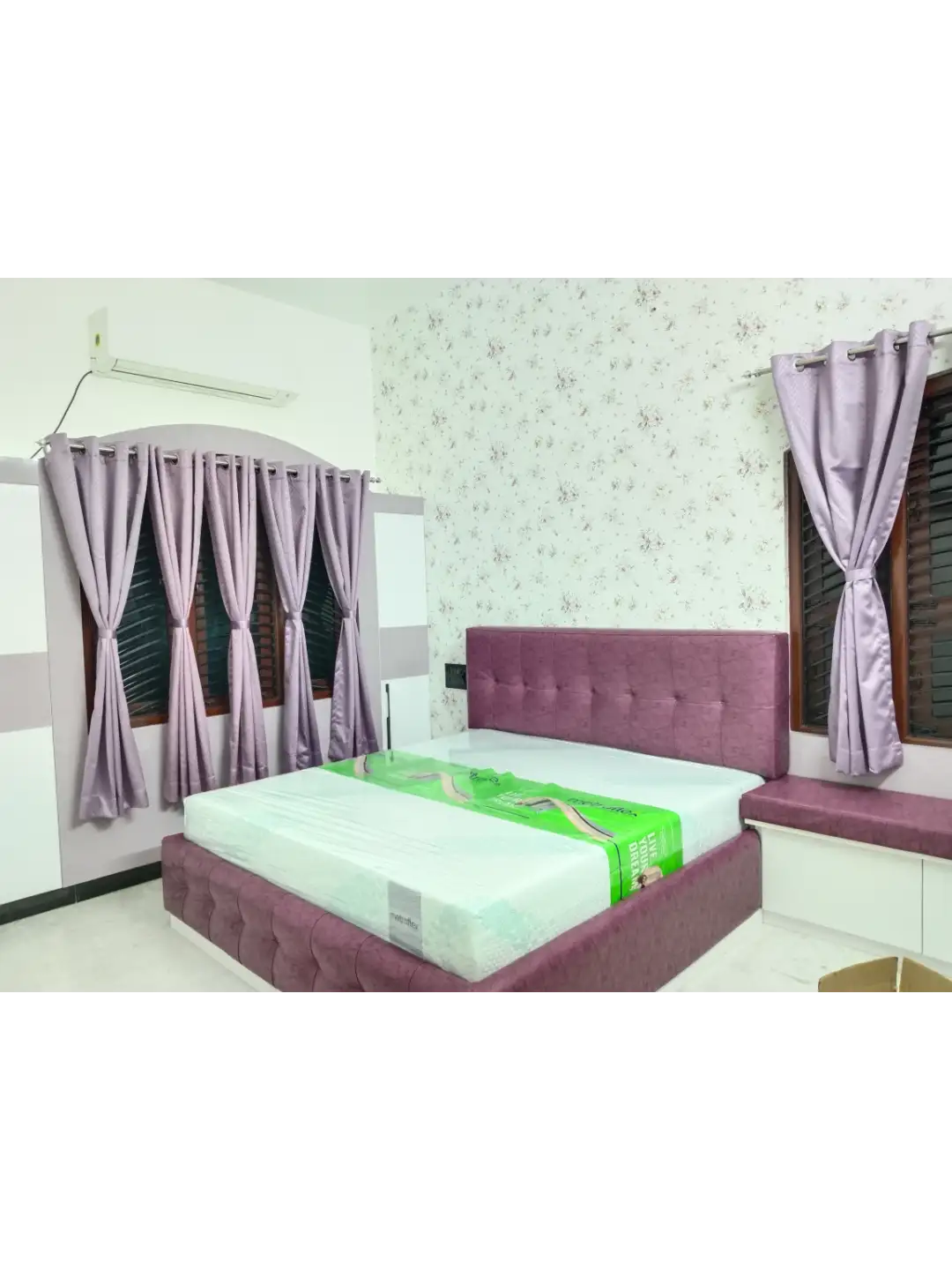 Living room in Karur styled with layered curtains and cushions by Catchy Decors